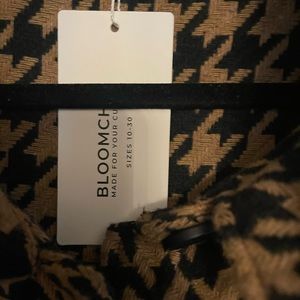 Brown coat with black buttons